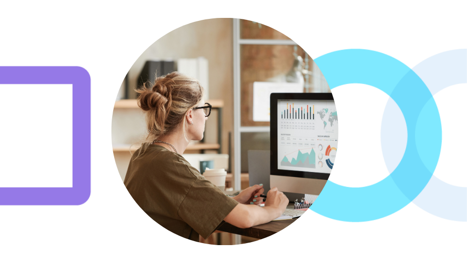 A data analyst reviewing collections charts and dashboards on a desktop monitor, representing the meeting point of behavioral analytics and behavioral science